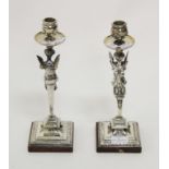 A PAIR OF HEAVY SILVER PLATED CANDLE STICKS