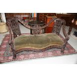 A VERY ORNATE CARVED VICTORIAN ANGLO-INDIAN SETTEE