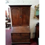 A GEORGIAN OAK BUREAU CABINET