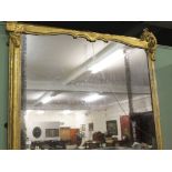 A LARGE VICTORIAN GILT OVERMANTLE MIRROR