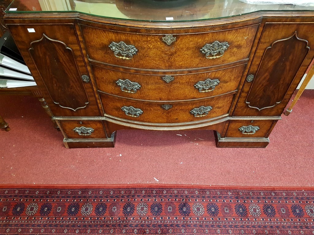 AN UNUSUAL GEORGE III STYLE MAHOGANY BOW-FRONTED SIDE BOARD