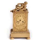 AN ATTRACTIVE FRENCH EMPIRE GILT BRASS BOUDOIR MANTEL CLOCK