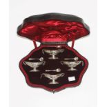 A GOOD CASED SET OF FOUR ADAM'S STYLE SILVER BOAT SHAPED SALTS