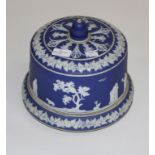 A LATE VICTORIAN BLUE AND WHITE JASPERWARE CHEESE DISH AND DOME