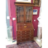 A GEORGIAN PERIOD INLAID AND CROSSBANDED MAHOGANY BUREAU BOOKCASE