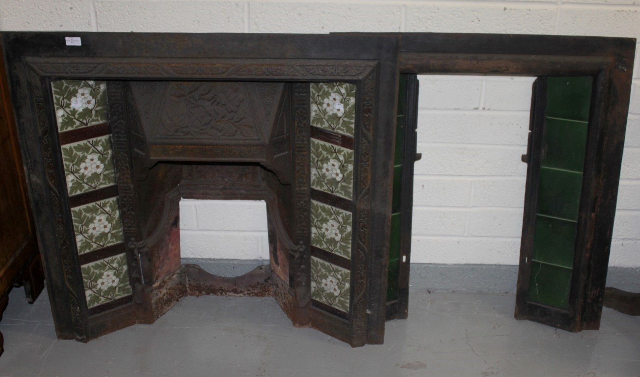 TWO SIMILAR CAST IRON MANTELPIECE INSETS,