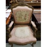 A FRENCH WING-BACK CARVED GILTWOOD ARMCHAIR