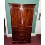 A GEORGE III STYLE SERPENTINE-FRONTED MAHOGANY COCKTAIL CABINET