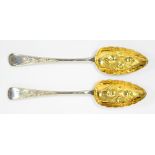 A PAIR OF GEORGE III SILVER TABLESPOONS LATER CHASED AND GILT AS BERRY SPOONS, LONDON 1801, 5OZS