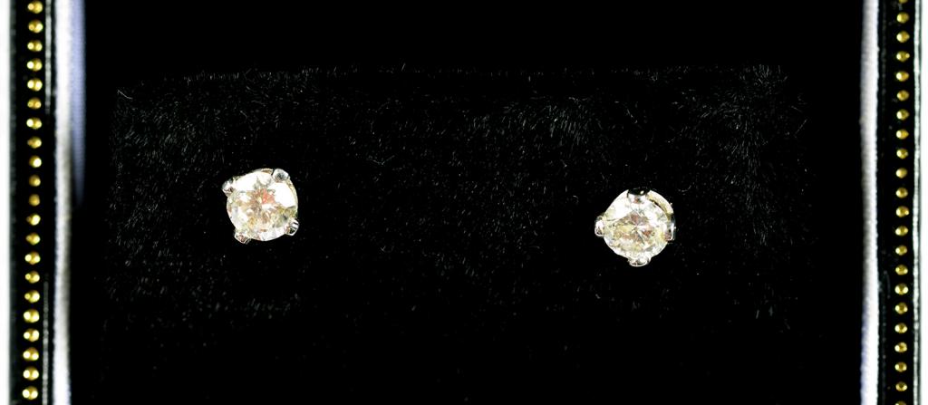 A PAIR OF DIAMOND SOLITAIRE EAR STUDS