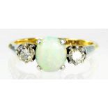 AN OPAL AND DIAMOND THREE STONE RING IN GOLD MARKED 18CT & PLAT, 3.2G