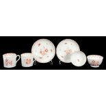 A PAIR OF ENGLISH PORCELAIN RED MONOCHROME PAINTED TRIOS OF TEA BOWL, COFFEE CAN AND SAUCER,