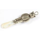 AN ELIZABETH II SILVER TEDDY BEAR NOVELTY BABY'S RATTLE WITH MOTHER OF PEARL HANDLE 8.5CM L