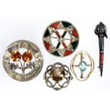 A VICTORIAN SILVER AND HARDSTONE SET BROOCH A SIMILAR CLAYMORE BROOCH AND THREE OTHERS