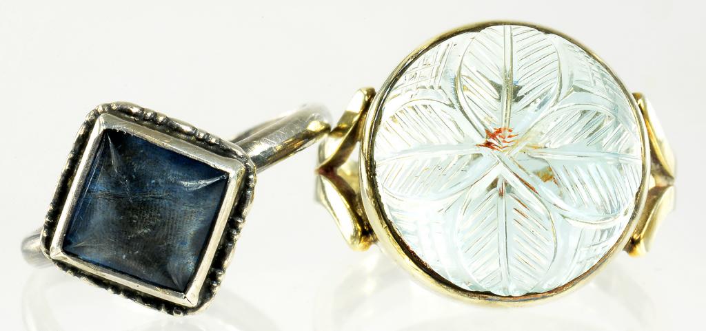 A CARVED AQUAMARINE SET 9CT GOLD RING AND ANOTHER RING