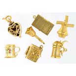 SEVEN 9CT GOLD CHARMS, 26.5G