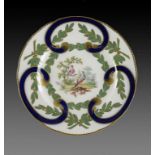 A COALPORT PLATE, IN SÈVRES STYLE, C1860 painted in the manner of John Randall with exotic birds,