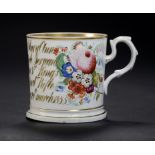 A COALPORT MUG, DATED 1855 painted with flower sprays and inscribed in gilt Presented to Mary Ann