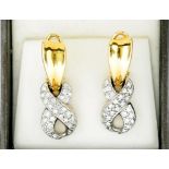 A PAIR OF DIAMOND PAVE SET TWO COLOUR GOLD EARRINGS, CLIP FITTINGS, MARKED 750, 11G