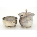 AN ARTS AND CRAFTS SILVER MUSTARD POT AND COVER AND A SALT CELLAR EN SUITE, HAMMER TEXTURED, MUSTARD