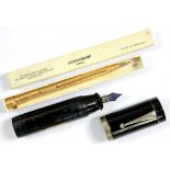 AN EVERSHARP GOLD PLATED PROPELLING PENCIL, BOXED AND A 1930'S JAPANESE EYEDROPPER 'JUMBO'
