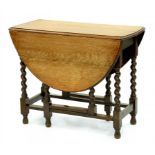 AN OAK GATELEG TABLE ON BARLEY TWIST LEGS, EARLY 20TH CENTURY