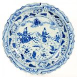 A CHINESE BLUE AND WHITE DISH IN MING STYLE, FREELY PAINTED WITH TWO HORSEMEN AND A STANDING