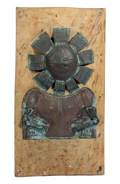 A SHEET BRASS WALL RELIEF OF A SUN DEITY, 20TH CENTURY with articulated cast brass bent arms, nailed