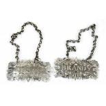 A PAIR OF VICTORIAN PIERCED AND ENGRAVED SILVER DECANTER LABELS - BRANDY AND SHERRY, 5CM W, CHAINED,