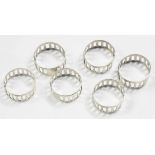 A SET OF SIX PIERCED SILVER NAPKIN RINGS, IMPORT MARKED LONDON 1947, 3OZS 15DWTS