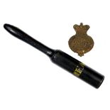 A VICTORIAN EMBOSSED BRASS HELMET PLATE AND A VICTORIAN BLACK PAINTED WOOD TRUNCHEON INSCRIBED VR,