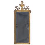 A CONTINENTAL CARVED GILTWOOD MIRROR, CRESTED BY AN URN, 95CM H, 19TH CENTURY AND A SMALLER MAHOGANY