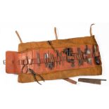 A HOLTZAPFFEL & CO LEATHER TOOL ROLL CONTAINING A COMPREHENSIVE VIRTUALLY FULL SET OF THE ORIGINAL