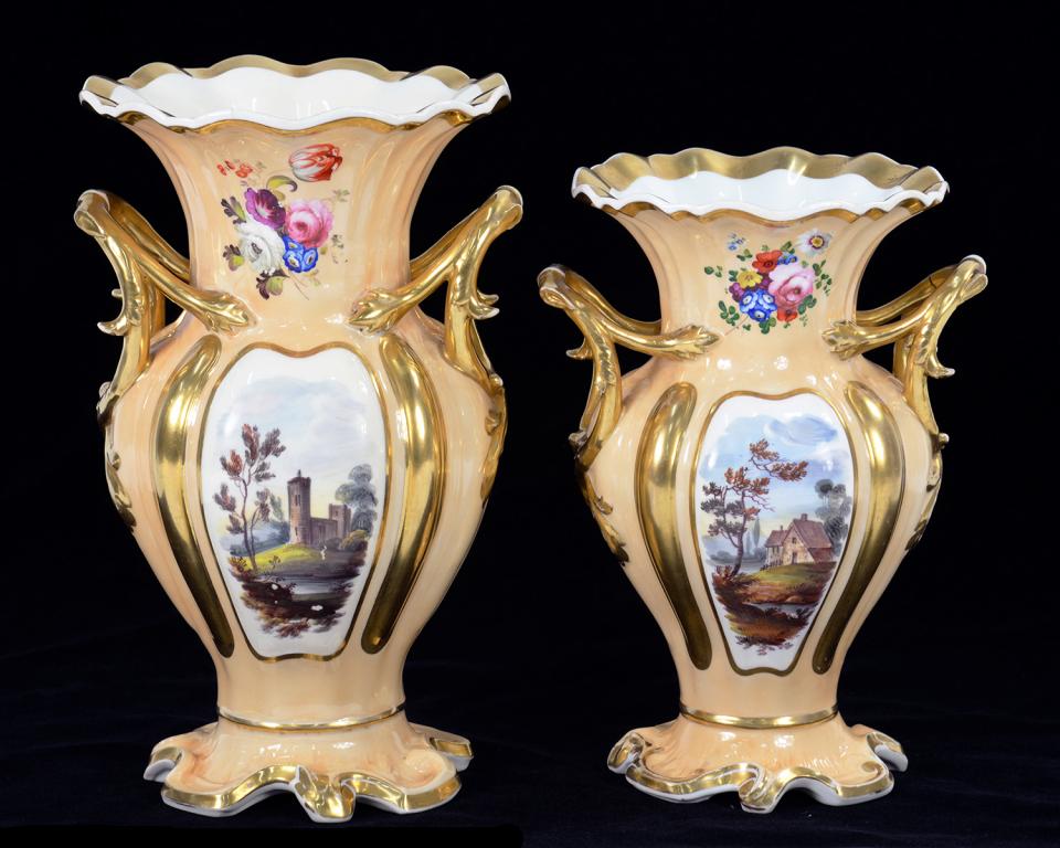 A GRADUATED PAIR OF JOHN RIDGWAY FAWN GROUND VASES WITH LANDSCAPE AND FLORAL SPRAY DECORATION,