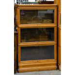 AN OAK GLOBE WERNICKE BOOKCASE, 143 X 86 X 37CM, IN THREE SECTIONS