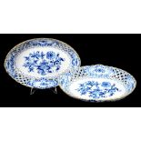 A PAIR OF MEISSEN PIERCED OVAL BLUE AND WHITE ONION PATTERN DISHES, 25CM DIAM