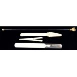 A LATE VICTORIAN IVORY PAGE TURNER WITH TUSK SHAPED HANDLE, ANOTHER WITH SILVER HANDLE, LONDON 1928,