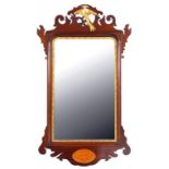 A VICTORIAN PARCEL GILT MAHOGANY FRETTED FRAME MIRROR, THE APRON WITH SHELL PATERA, 90CM H