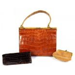 A CROCODILE HIDE LADY'S HANDBAG