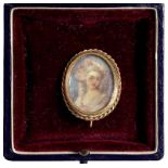 A DECORATIVE MINIATURE OF A LADY IN 18TH CENTURY STYLE, IN 19TH CENTURY IN GOLD AND GILTMETAL