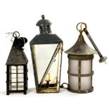 AN OXIDISED COPPER HALL OR PORCH LANTERN WITH CYLINDRICAL GLASS SHADE, 50CM H INCLUDING SUSPENSION