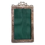 AN EDWARD VII SILVER PHOTOGRAPH FRAME WITH RIBBON CREST, 19.5CM H, LONDON 1901