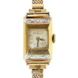 AN 18CT TWO COLOUR GOLD CHAMFERRED RECTANGULAR LADY'S WRISTWATCH, IMPORT MARKED, EDINBURGH 1926 ON