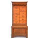 AN OAK INDEX CABINET WITH TAMBOUR SHUTTER, EARLY 20TH CENTURY, 139CM H