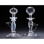 TWO SIMILAR GLASS OIL LAMPS, LATE 18TH C soda metal, folded foot, one with tin wick holder, 24 and