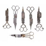 SIX PAIRS OF ENGLISH BURNISHED STEEL OR SHEFFIELD PLATE WICK TRIMMERS, EARLY 19TH C one with cutter,