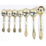 A SMALL QUANTITY OF ORNATE NORTH AMERICAN SILVER FLATWARE INCLUDING A CREAM LADLE, ETC, EARLY 20TH