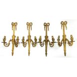 A SET OF FOUR EMPIRE STYLE GILT BRASS TWO BRANCH WALL LIGHTS, 44CM H, MID 20TH C