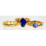 A 9CT GOLD RING SET WITH LAPIS LAZULI, ANOTHER WITH A BLUE STONE EN CABACHON AND 9CT GOLD FACETED