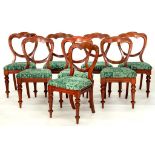 A SET OF EIGHT VICTORIAN MAHOGANY BALLOON BACK DINING CHAIRS